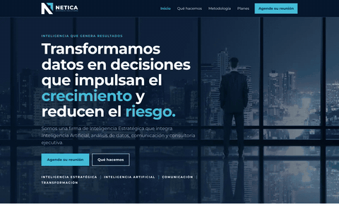 Looping screen recording of the first build of the Netica website, the starting line: its home page scrolling from the top in a desktop window 1440 pixels wide. It shows a headline over a photograph of a city at night, then a white section with a second headline and a photograph of an iceberg.
