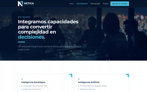 Looping screen recording of the first build of the Netica website, the starting line: its services page scrolling from the top in a desktop window 1440 pixels wide. It shows a headline over a dark photograph, then a grid of four cards.